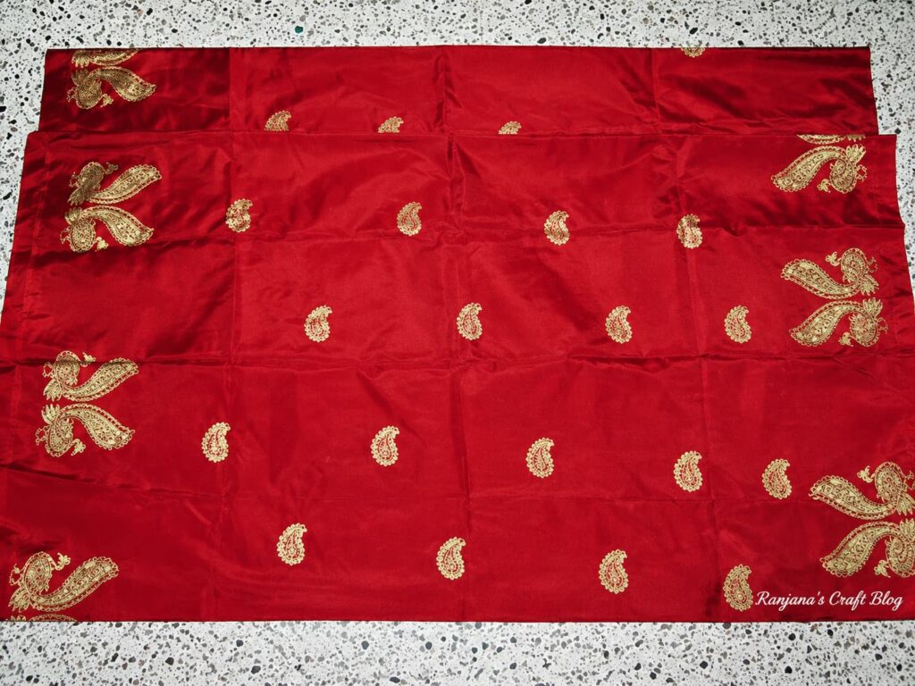 Red saree with peacock motif