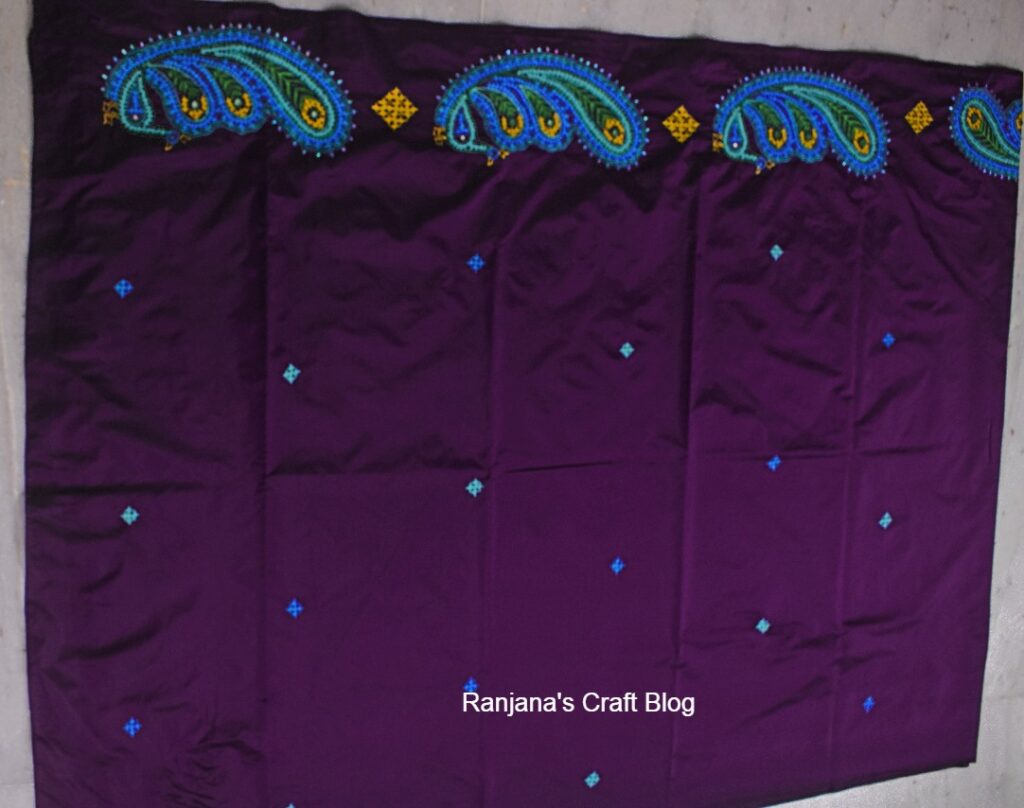 Peacockkutchwork motif on saree